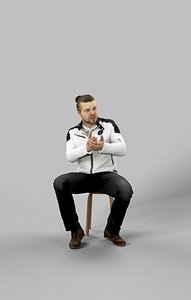 Sitting Man Keen Casual in Jeans and White Jacket Sitting Explaining