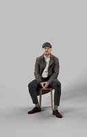 Sitting Man Business In A Winter Coat And A Newsboy Tweed Cap Master