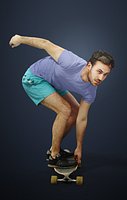 Flow A Caucasian Male Getting Ready To Perform A Jump On His Skateboard