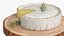 Round Brie Cheese with Rosemary on Rustic Board