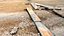 Gravel Wood Planks 01 - Scansione del modello di fotogrammetria 3D di ghiaia bagnata con assi di legno e un guanto