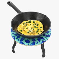 Omlette in a skillet on a trivet