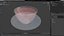 Taza pequeña con plato lleno de té