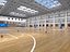 Modello 3D di un'ampia arena polisportiva al coperto con campo da basket.