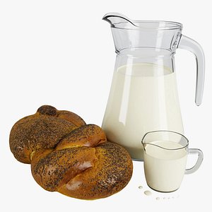 Milk in a jug with a bun