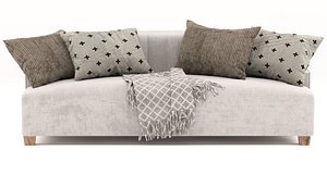 Modern looking three seat sofa with throw pillows and throw blanket