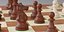 Chess pieces with rigged and posed figurines