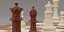 Chess pieces with rigged and posed figurines