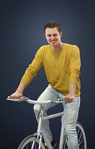 Virtue A Casual Man Wearing A Yellow Sweater While Riding His Bicycle