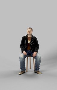 Sitting Man Victory Caucasian In A Leather Jacket And Torn Jeans