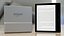 Libro cartaceo con collezione di e-reader