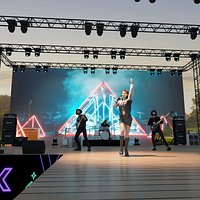 Performer Modern Stage Rock Band Singing Concert Grassland Concert Beauty Handsome Guy Drummer Guita