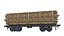 Rungenwagen beladen mit Baumstämmen