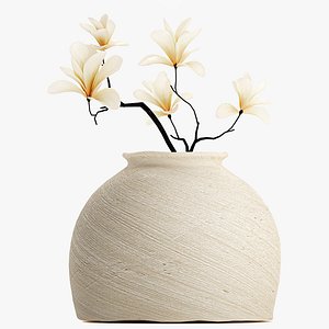 A bouquet of white magnolia blossoms on branches in a vase