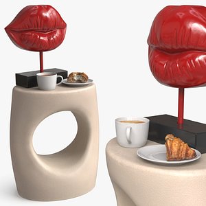Side Table with Lip Sculpture and Coffee Cup Pastry