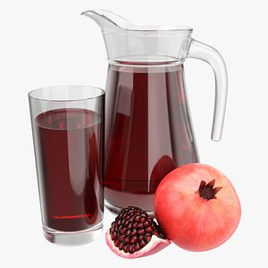 Jug and glass with pomegranate juice and fruit