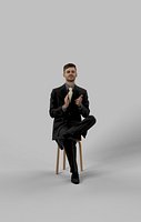 Business Man Sitting Posture In A Black Suit Clapping