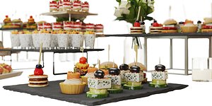 Catering Buffet Table Set with Appetizers and Desserts