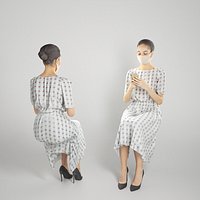 Sitting attractive lady in a dress and mask is texting a message 186