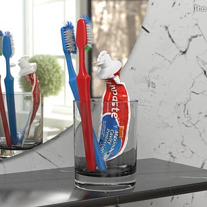 Glass with Used Toothbrushes and Toothpaste