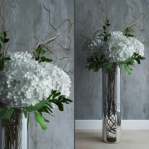 White hydrangeas in tall vase with willow branches