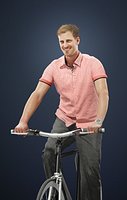 Mistery A Caucasian Male Wearing A Pink Short-Sleeved Shirt While Riding His Bicycle
