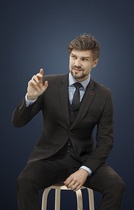 Ingrain A Caucasian Male Sitting in a Cafe While Ordering