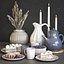 A set of dishes with cake, muffins and dried flowers