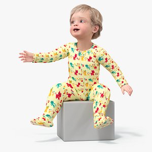 Toddler Aged 1 Year in Pajamas Sitting Pose