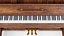 Pianoforte verticale in legno scuro