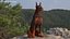 Brown Doberman Pinscher Sits Fur for Maya
