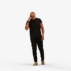 00356Carl008 - Adult Black man walking outdoors calling on smartphone in transitional seasonal cloth