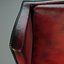 Sillón orejero vintage de cuero con tapizado en rojo envejecido