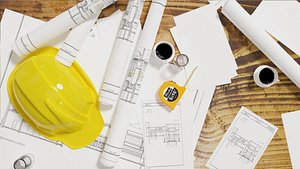 artchitectural scene includes contruction helment tape measure