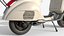 Классический винтажный скутер Vespa - кремового цвета.