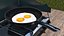 Estufa de camping con huevos fritos