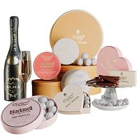 Gift set of sweets and collectible sparkling wine. Candy and chocolate