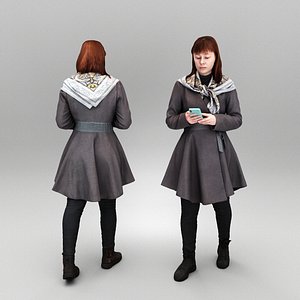 Woman in coat using smartphone 428