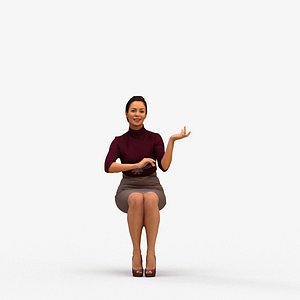 00574Nicole014 - Adult Caucasian woman talking while sitting in office wearing autumn attire