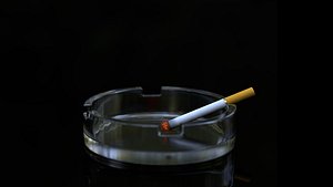 Ashtray With Burning Cigarette