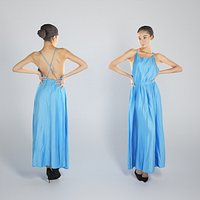 Beautiful woman in blue long dress posing 250