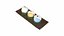 Thai traditional sweets Khanom Phra Pai  Coconut Dumpling on a dark wooden tray
