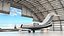 Business Jet Bombardier Challenger 604 in un hangar per aerei attrezzato