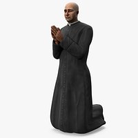 Catholic Priest Praying on His Knees