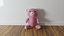 UN OSO DE PELUCHE DE COLOR ROSA BONITO
