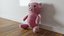 UN OSO DE PELUCHE DE COLOR ROSA BONITO