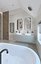 Spacious bathroom with stone tiles