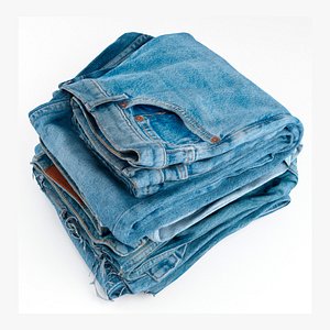 Pile or stock of folded blue jeans pants for wardrobe
