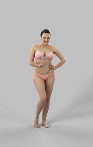 Dream A Caucasian Woman Standing In Her Pink Bikini While Holding A Cocktail Glass In One Hand