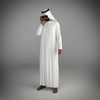 Traditional arab man from dubai posed talking on the phone